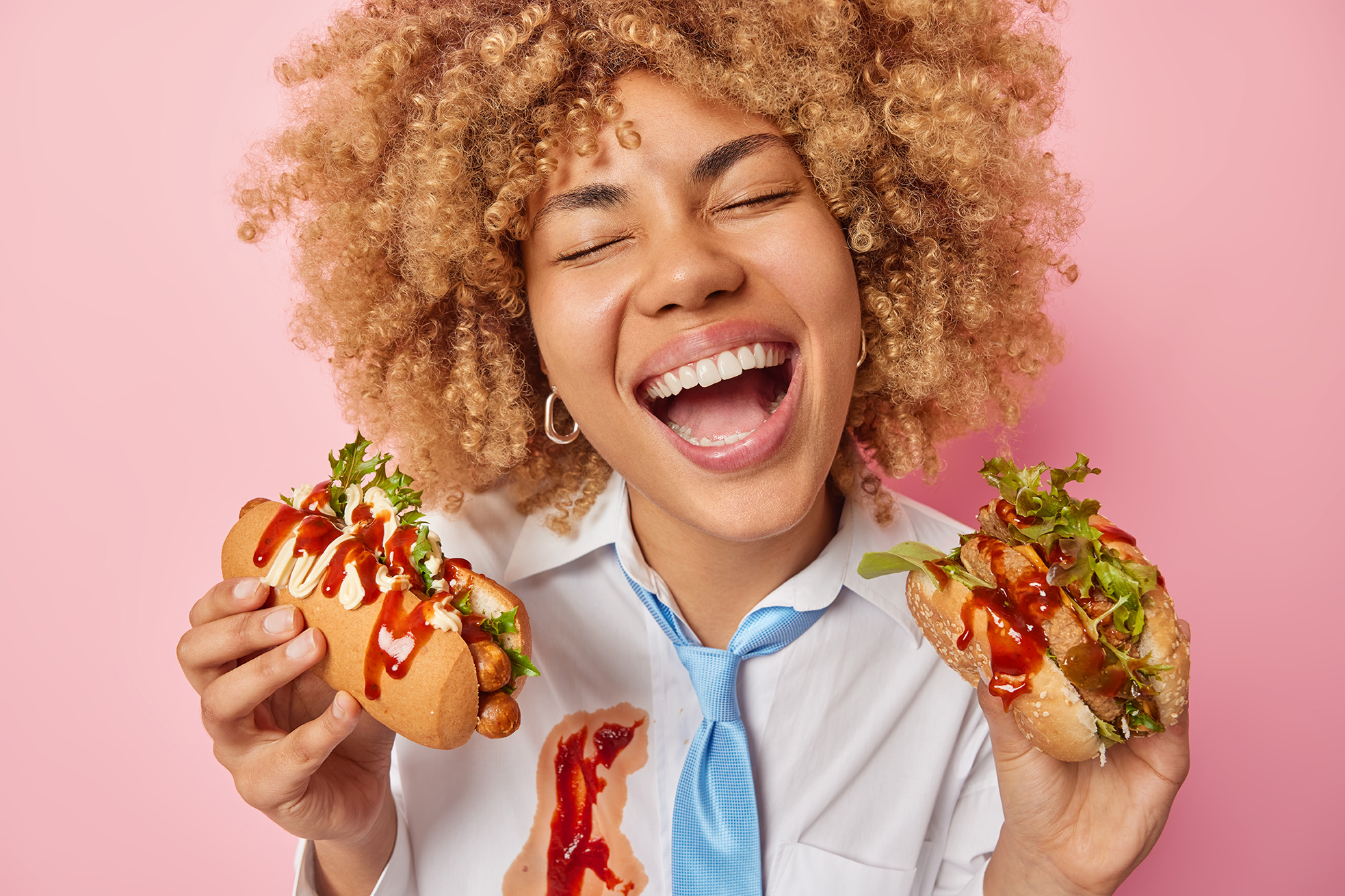woman eating hot dog